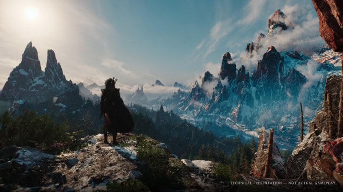 Ciri de dos sur un promontoire, face à une vallée de montagnes enneigées noyée dans les nuages