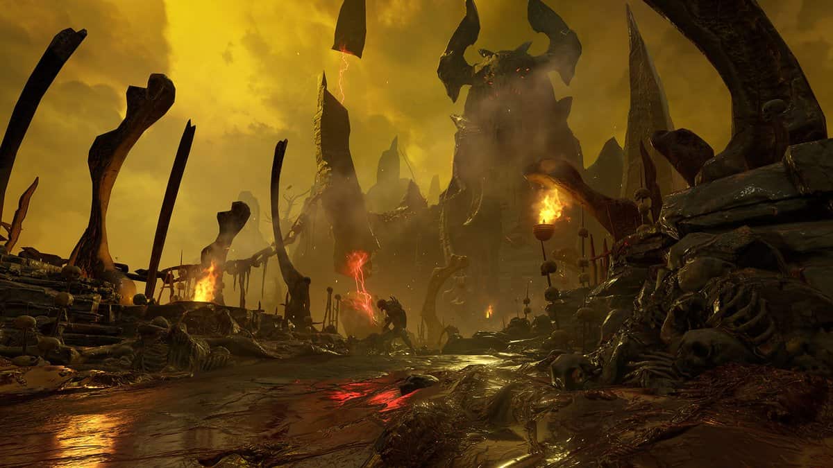Paysage infernal sous un ciel jaune, ossements géants et statue démoniaque au loin
