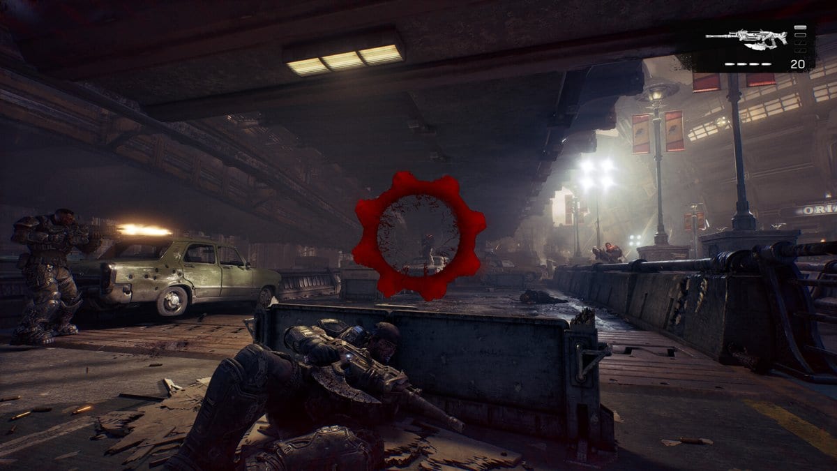 Capture de Gears of War: E-Day : un soldat accroupi derrière une barricade vise un ennemi, réticule rouge au centre